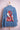 Blue denim jacket with embroidered woman in traditional red headdress and floral design on back