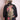 Back view of a woman wearing a black denim jacket with embroidered peacock and floral design