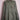 Olive green military-style jacket with buttoned pockets on pink wire dress form