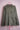 Olive green military-style jacket with buttoned pockets on pink wire dress form