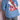Back view of man wearing light blue denim jacket with intricate red embroidered Asian woman and floral design