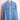 Light blue denim men's shirt with buttoned chest pockets hanging on wooden hanger