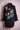Black denim jacket with embroidered birds and pink cherry blossoms on the back