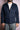 man wearing navy blue casual jacket with flap pockets and white textured sweater