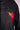 Black denim jacket with red and gold embroidered bird patch featuring bright red feathers on pocket