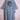 Light blue denim kimono with beaded tiger head design on back, displayed on pink hanger
