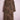 Long brown leopard print trench coat with double-breasted buttons displayed on pink metal stand