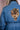 Blue denim jacket with detailed golden tiger patch featuring red eyes on back